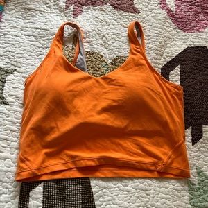 Women’s bright orange sports bra